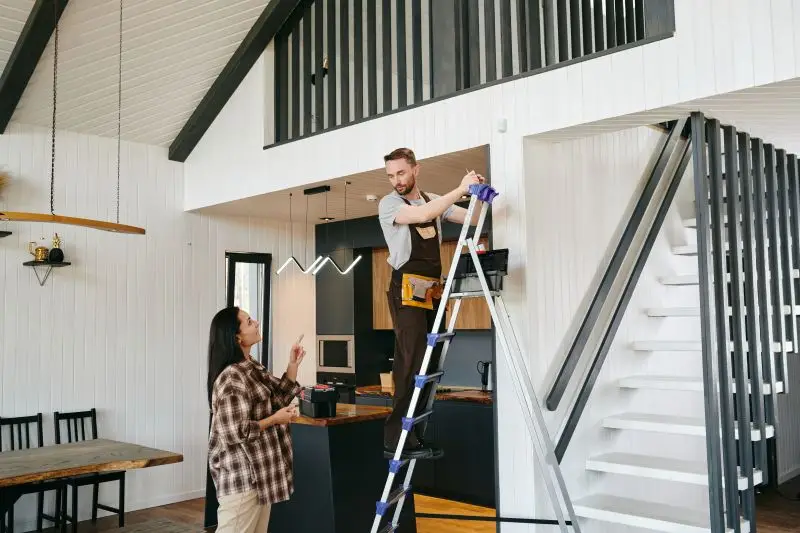 Orange County homeowner and contractor reviewing safety protocols and liability protection documents