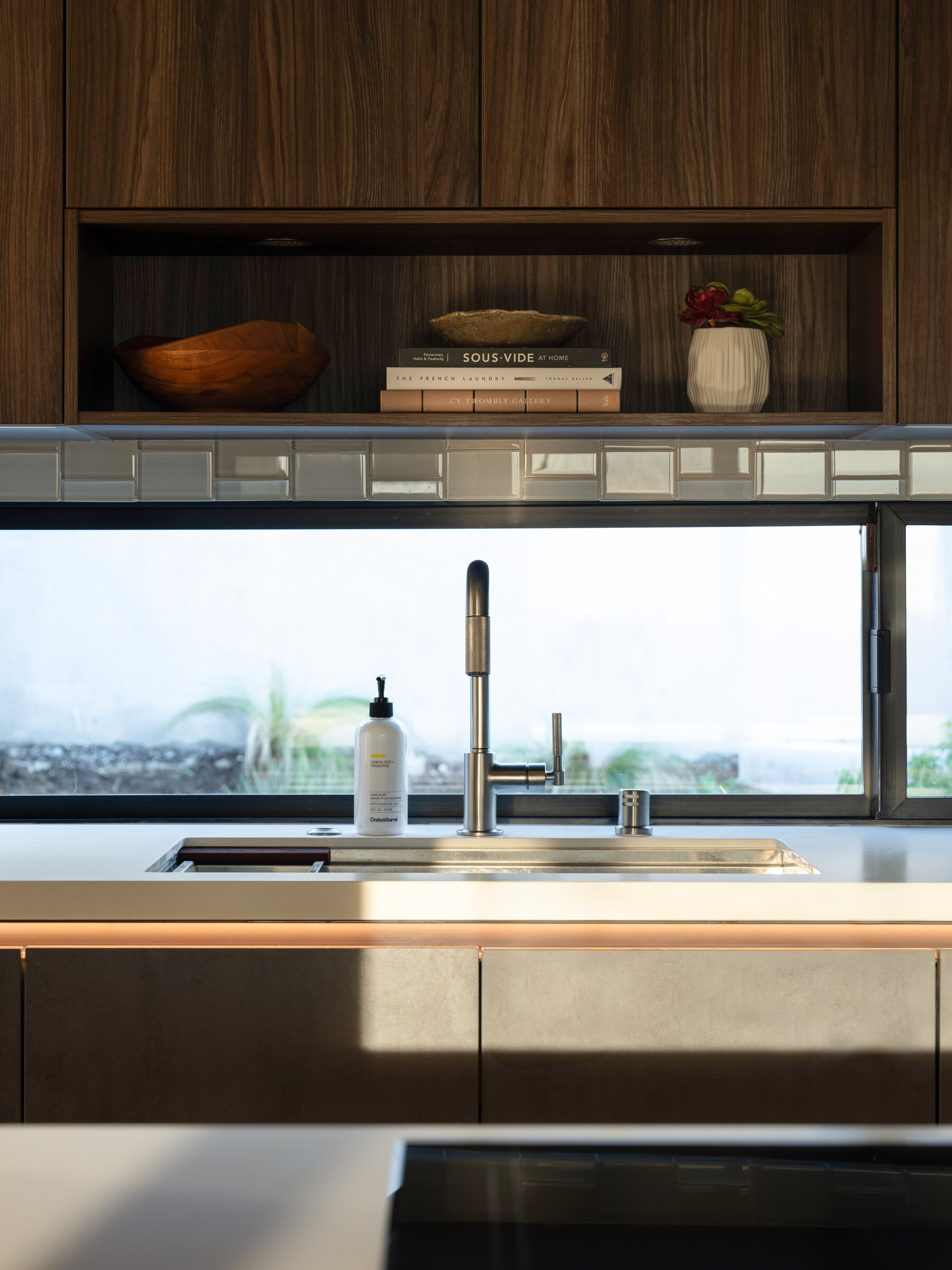 Open kitchen and living area planned to improve circulation, storage, and everyday use in a smaller home